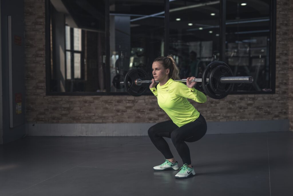 Girl lifting weights for the keto diet